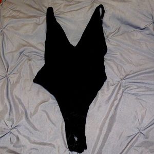 Sexy shiny black bodysuit